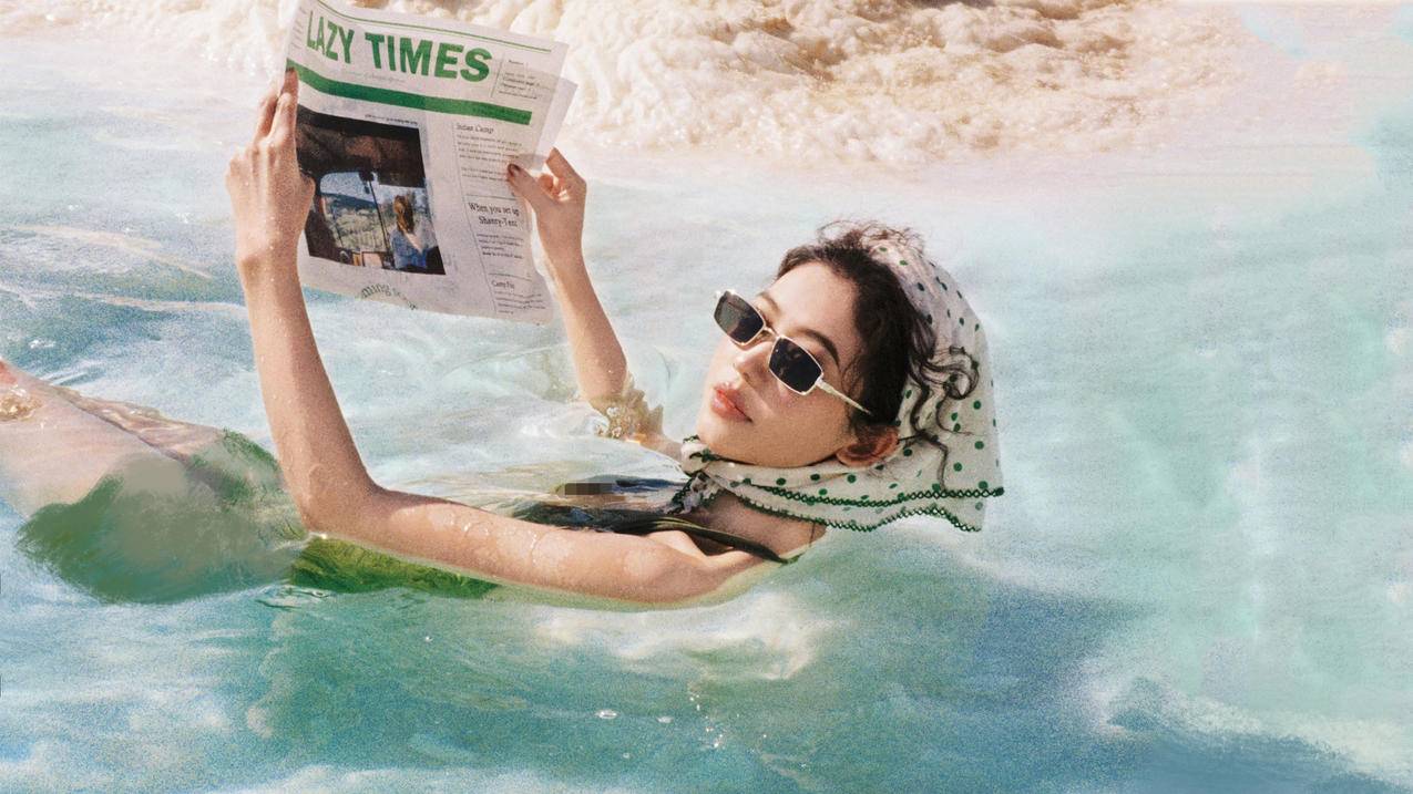 海面 美女 报纸 绿色 4K高清壁纸